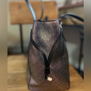 Hard to find Michael Kors hologram iridescent Voyager bag.